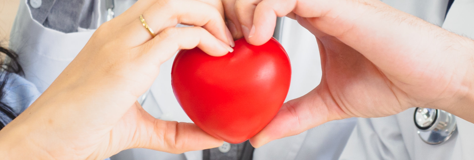 a hand holding a heart shaped object